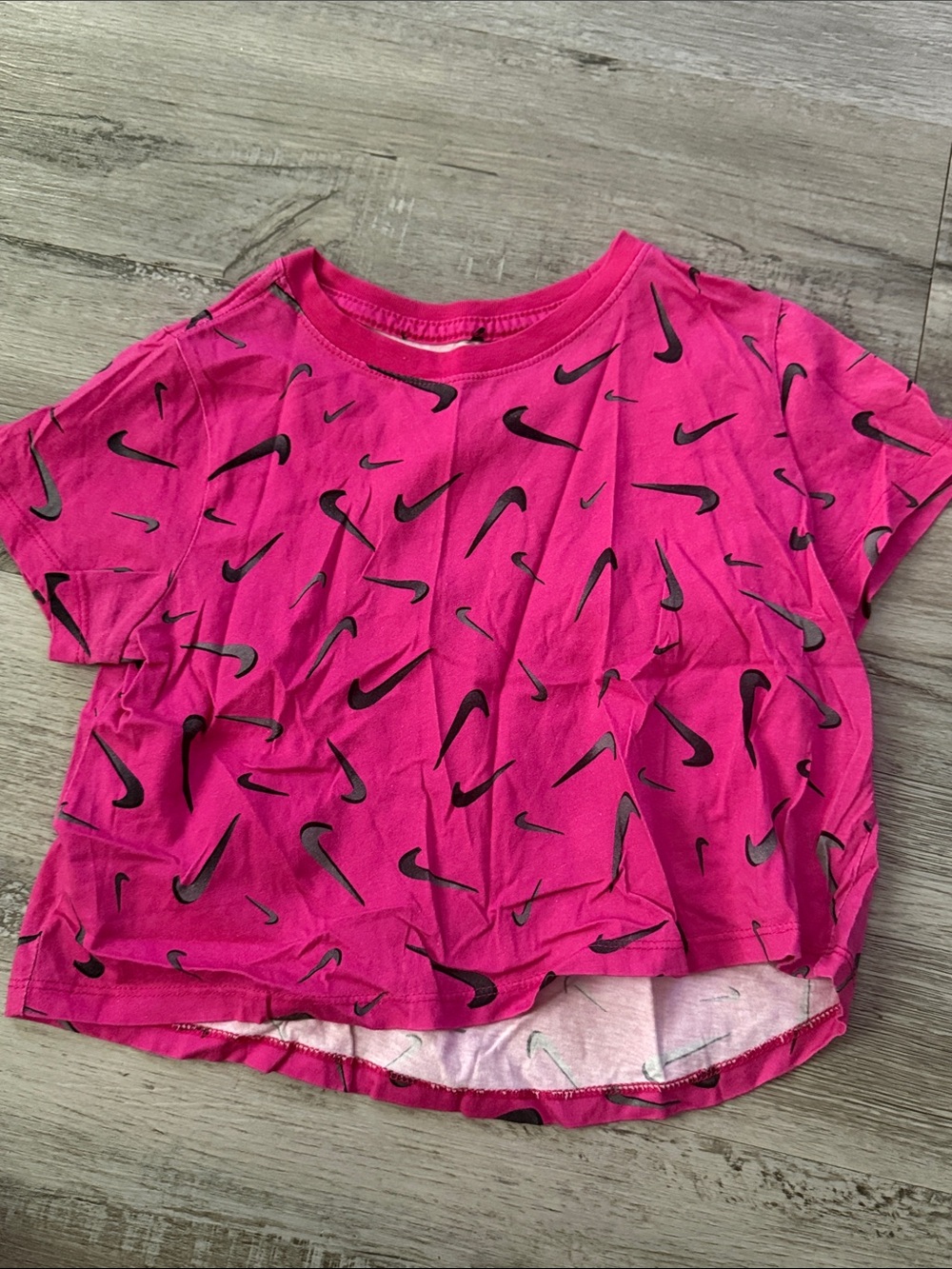 Nike Hot Pink Short Sleeve Tee with Black Swoosh Pattern
